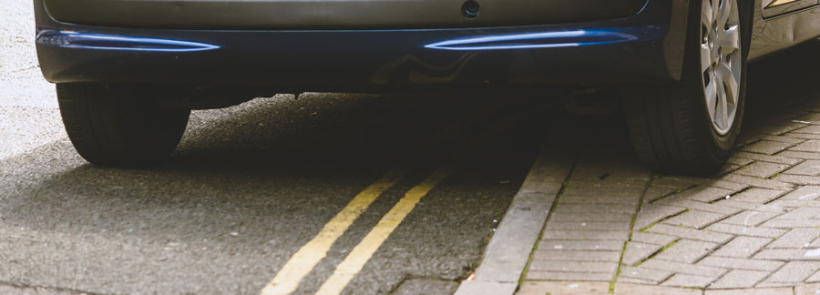 Car parked on yellow lines